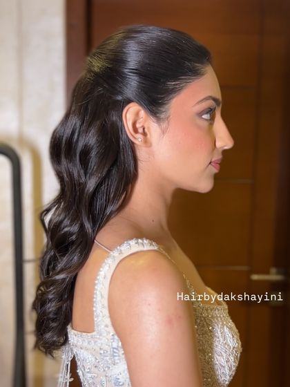 A final, clear shot of the elegant half-up, half-down hairstyle.