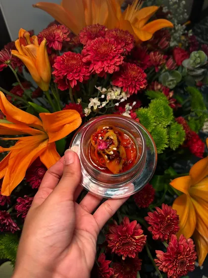 A glass cup holding a delicious appetizer, highlighting the use of elegant and varied glassware in our service.