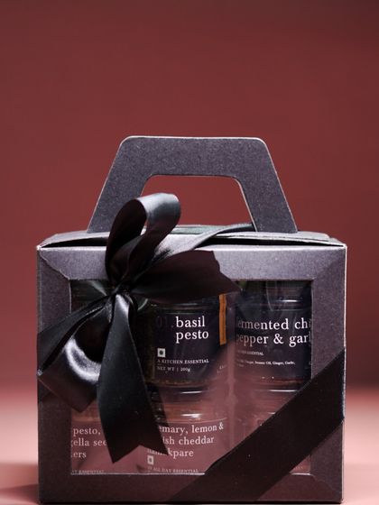 Our smaller gift sets, like this beautifully packaged box of three assorted pantry jars, are perfect for corporate gifting or as a thoughtful gesture for acquaintances. The clear window and elegant ribbon offer a lovely presentation.