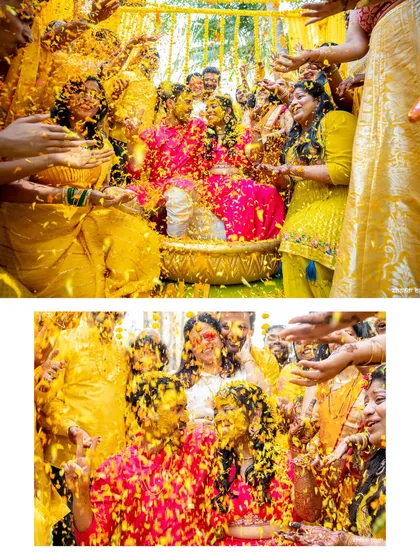 A shower of flower petals during the haldi ceremony. The explosion of color and the couple's expressions make this a vibrant and dynamic shot.