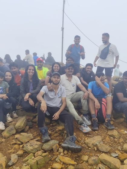 The whole batch celebrating at the rocky summit of Kudremukha. The feeling of community and achievement is what my treks are all about.