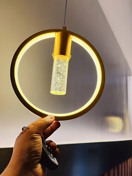 Small details can make a big impact. This chic crystal hanging light is perfect as a bedside lamp or for adding a touch of glamour to a corner, and it comes with adjustable light settings.
