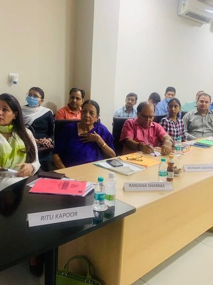 At the head of the table during a session on the POSH Act for the DLF Industries Association in Faridabad. These workshops are crucial for creating awareness among industry members.