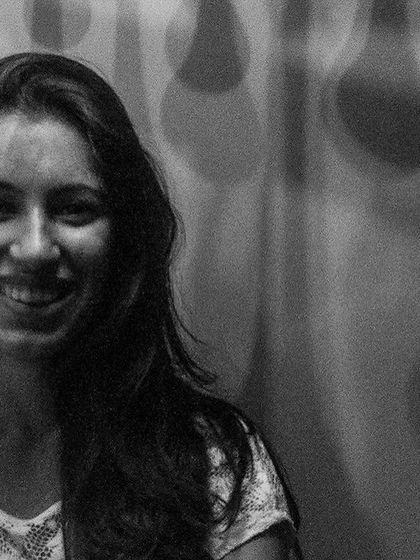 A genuine, happy smile captured in black and white. This portrait from the 'Ignite' series is a beautiful example of capturing authentic joy.