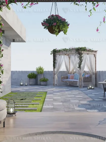 A romantic corner of the Rajouri Garden terrace, with a curtained gazebo swing and lantern lighting, creating a perfect spot for quiet evenings.