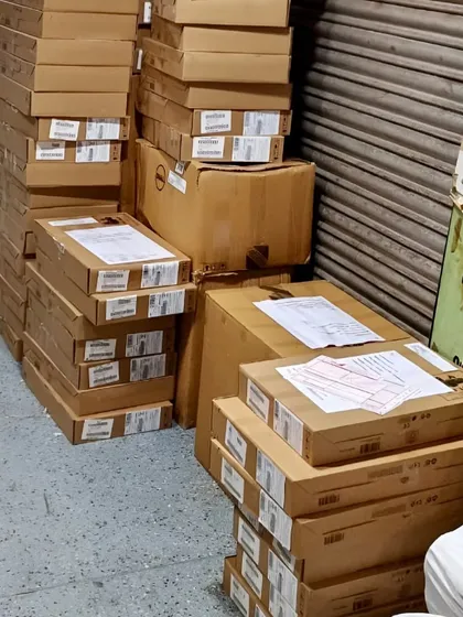 Stacks of boxes ready for dispatch. Whether it's a single topper or a large bulk order, I ensure every package is handled with care.