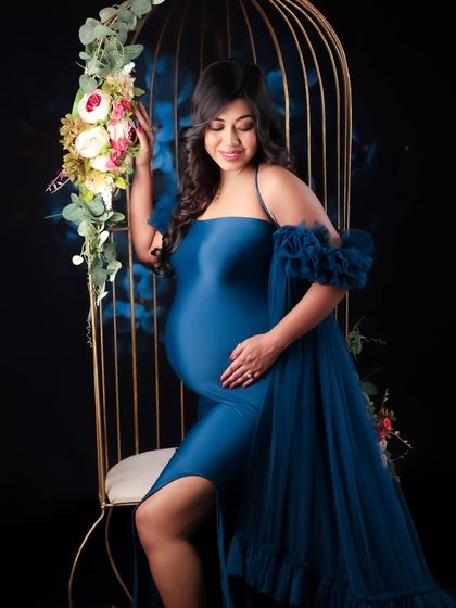A collection of artistic shots featuring a gorgeous royal blue gown, from full-length portraits to creative close-ups on the fabric and bump.