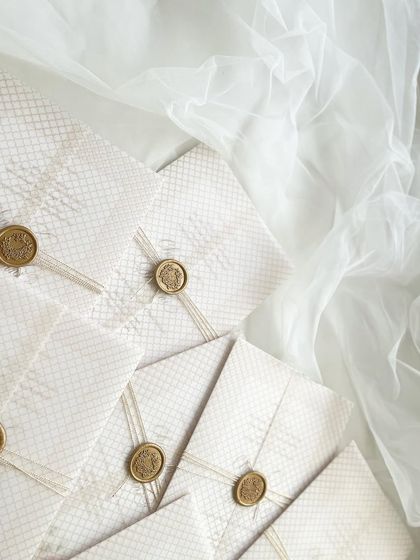 Everything for my sister's wedding invitation was done in-house. This is the final wrapped package, with a vellum overlay, string, and a custom wax seal.