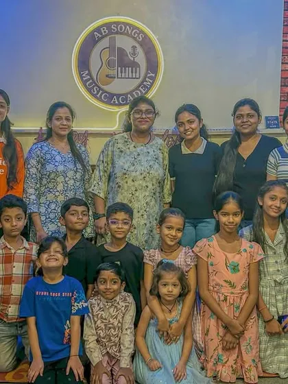 Our academy is like one big family. This is a snapshot from one of our student birthday parties, with everyone from the youngest kids to our adult learners celebrating together.