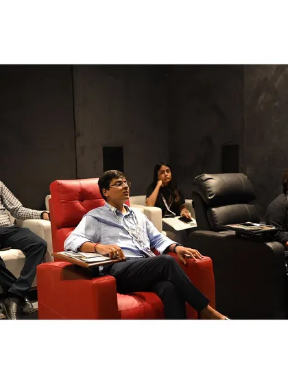 Visitors relaxing in the recliners of our demo home theatre. We encourage everyone to sit back and experience the comfort and quality of our solutions firsthand.