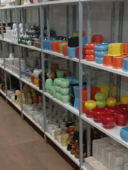 An aisle view of our store, showcasing the extensive range of planters we offer. You can find everything you need for your gardening projects in one place.