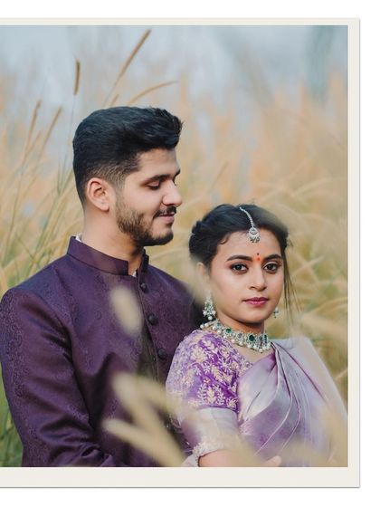 A serene and intimate portrait in a field of pampas grass. The soft light and the couple's gentle pose give this photo a dreamy, romantic quality.