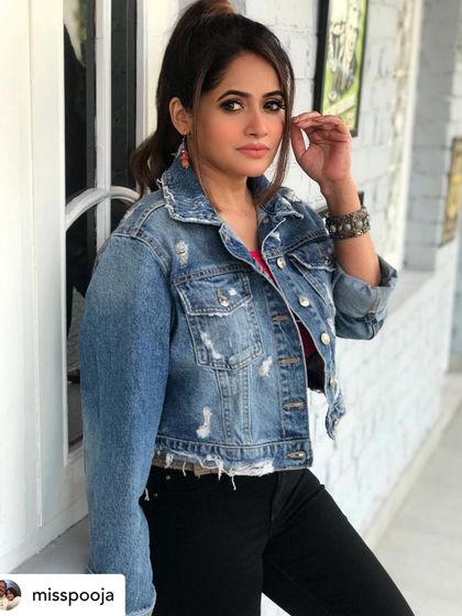 Styling the iconic Miss Pooja for 'Makkhi'. I gave her a cool, contemporary look with a distressed denim jacket over a bright top and black jeans, accessorized with oxidized silver jewelry for an edgy touch.