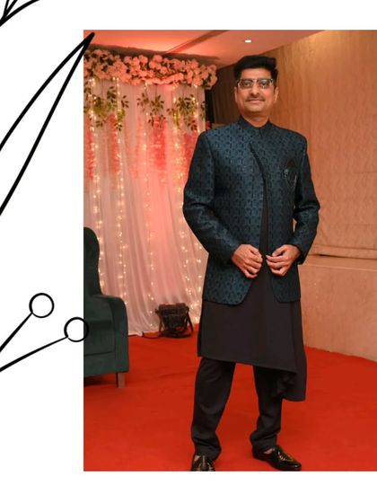 This guest looks sharp and sophisticated in a dark green patterned Jodhpuri jacket paired with a black kurta. A great option for any formal wedding event.