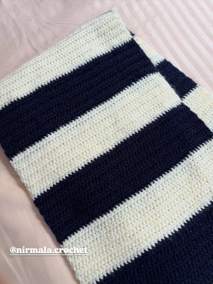 The clean, even stitches of our handmade striped muffler before the fringe and initial are added.