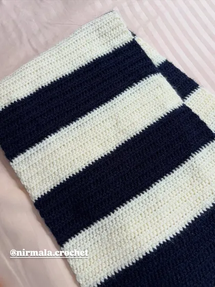 The clean, even stitches of our handmade striped muffler before the fringe and initial are added.