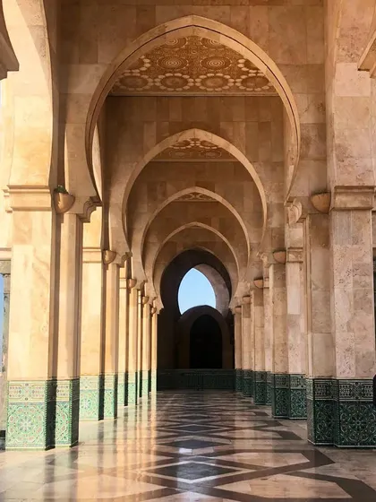 The grand arches of the Hassan II Mosque in Casablanca. The scale, the geometric patterns in the tilework, and the sheer beauty of the architecture are a profound source of inspiration.