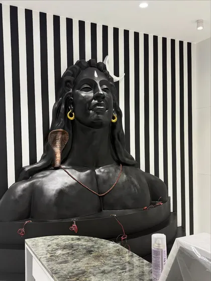 An in-progress shot of the Shiv mural installation at the office entrance. You can see how the large-scale piece is carefully fitted into the reception area.