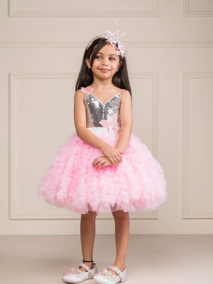 A perfect pink party dress with a silver sequin heart bodice and a fluffy, layered tulle skirt.