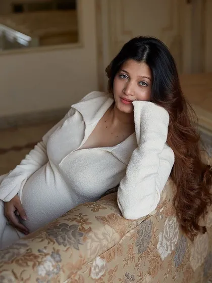 We captured this serene maternity portrait during an intimate home session in Ranchi. The soft, natural light and cozy knit dress create a feeling of warmth and comfort, which is exactly what I aim for when I travel to you for a shoot.