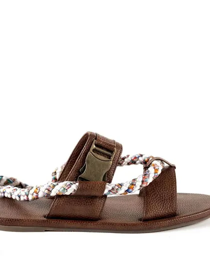 A side view of the brown leather sandal, focusing on the buckle detail and the texture of the leather. This image provides important visual information for a potential buyer.