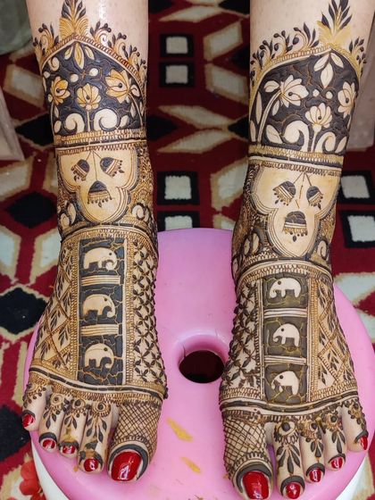 This foot design features panels of elephants, a popular and auspicious motif for bridal henna.
