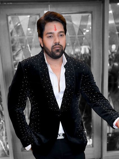 A client looking dapper in our black velvet blazer with scattered crystal work. The monochrome effect gives it a very classy and sophisticated feel.