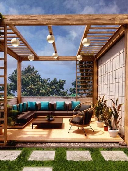 A luxurious rooftop terrace design featuring a wooden pergola with climbing plants. The comfortable L-shaped sofa and ambient string lighting make this an ideal space for outdoor lounging and entertaining.
