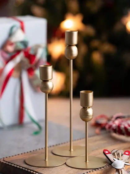 These elegant gold candle stands are perfect for holding my tapered candles and adding a touch of sophistication to your holiday decor.