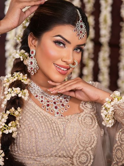 A bright and happy portrait. The makeup is designed to look fresh and radiant, perfect for daytime events and photos.