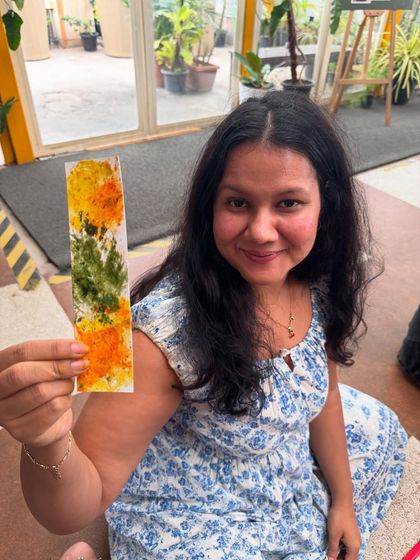 The vibrant colors of marigold and other flowers transferred beautifully onto this handmade bookmark. It's a lovely, functional keepsake to remind you of a creative afternoon.
