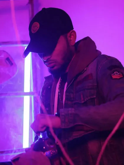 A moody, purple-lit shot that reflects my focus on the grind. The caption says it all: worry less about followers and more about your dollars.