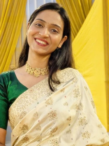 Dressed up for a wedding or function, embracing the festive look.