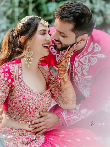 A moment of pure, uninhibited laughter between the couple during their Mehendi shoot, showcasing their fun-loving chemistry.