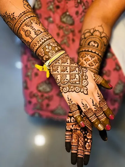 Another view of this bridal set, showing the flow of the design from the back of the hand up the arm.