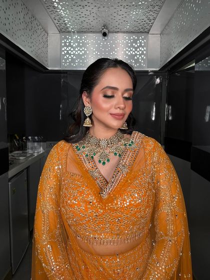A serene shot of the bride, her eyes closed, looking peaceful and beautiful.