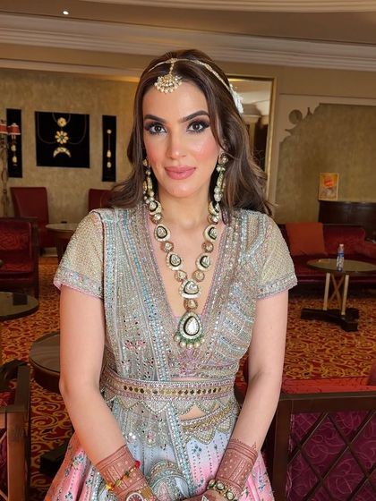 Embracing the gentle allure of soft waves, crowned with a beautiful headband of white flowers.