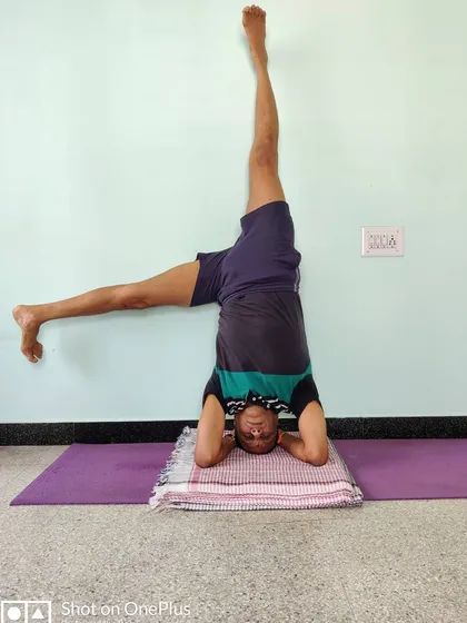 Here I am demonstrating a variation of Shirshasana (Headstand), using the wall for balance and alignment. This is Parsvaika Pada Shirshasana. The wall is a tool, a teacher. It provides feedback so you can understand the correct extension and rotation in the pose without fear of falling.