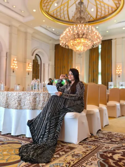 A final review of my notes in the grand ballroom before guests arrive. This is where the magic begins.