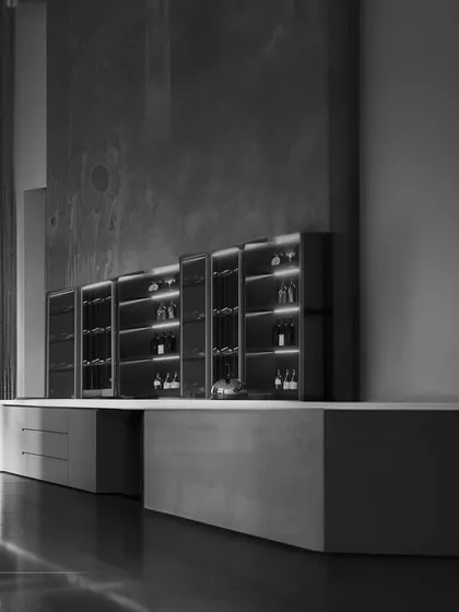 The interiors of our residences feature sophisticated details, like this modern bar and storage unit. Every corner is crafted to provide a functional and luxurious living experience.