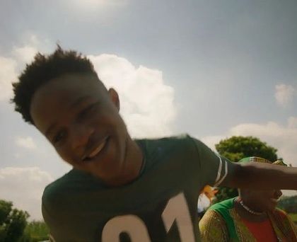 A happy, candid moment captured during the SanDisk shoot. The simple green jersey with number detailing adds a sporty, youthful element to the character's look.