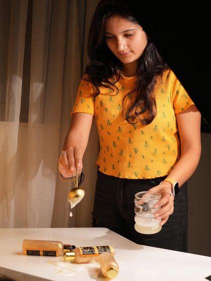 A behind-the-scenes moment showing the 'jugaad' behind a perfect drip shot. Patience and a steady hand are key to capturing that one perfect moment.