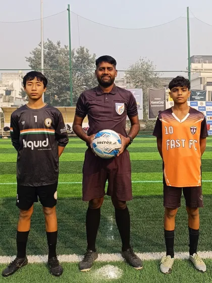 The captains from Fast FC and Olimpic FA with the referee before a Delhi Future Stars Youth League match.