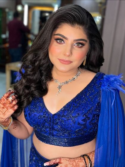 A close-up of this beautiful client. The eye makeup is a perfect smokey blend, and her skin is absolutely glowing.