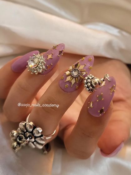 This view highlights the different charms and embellishments used in this Navratri set, including the dangling jhumka and the sparkling star-shaped crystals.