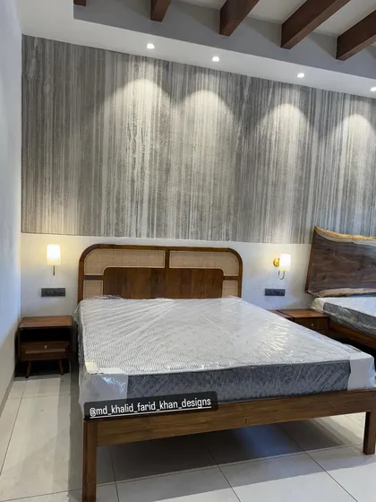 A view showing both the cane headboard bed and the live-edge wood bed in the same room.