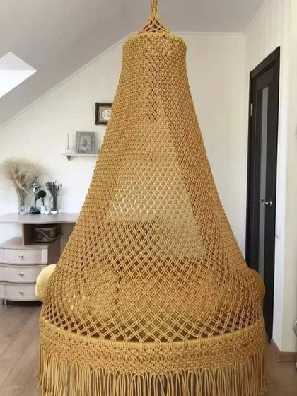 A full view of our golden-yellow swing, showing how it can be a beautiful centerpiece in a room with a high or slanted ceiling.