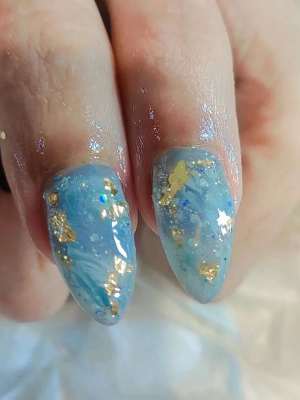 Another detailed shot of the encapsulated art, showing the beautiful combination of blue, gold foil, and glitter for a marble-like, underwater effect.