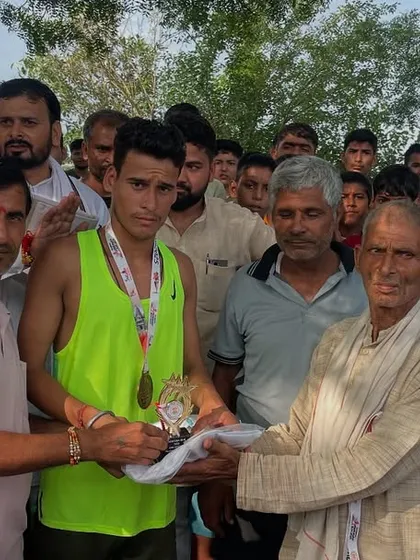 A young winner receiving his trophy and prize. It is my 'dharm' to encourage these young 'cheete' and give them a platform to prove their 'mehnat'.