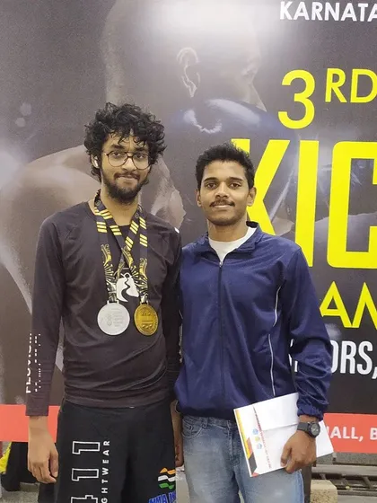 I'm incredibly proud of my students. Here is one of our fighters after winning medals at the 3rd State Level Kickboxing Championship. We don't just train, we build champions.